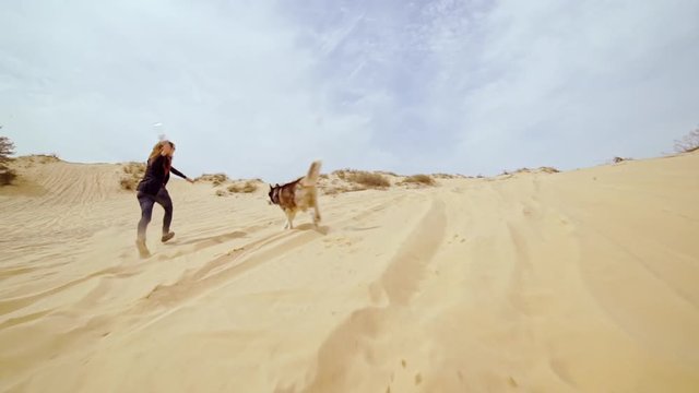 Family spending time together and having fun in Oleshky sands.Ukraine. Slow motion