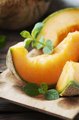 Sweet orange melon on the wooden table