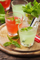 Mix of red and green cocktails with rum and mint