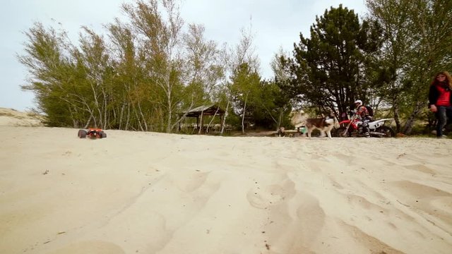 Family spending time together and having fun in Oleshky sands.Ukraine. Slow motion