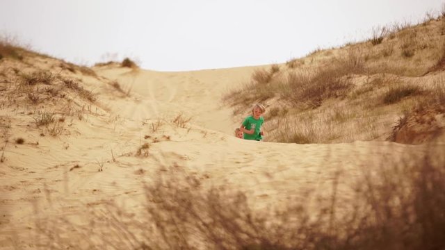 Family spending time together and having fun in Oleshky sands.Ukraine. Slow motion