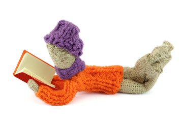 Boy with violet cap reading crafts burlap