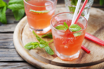 Fresh alcohol cocktail with rum, berry and mint