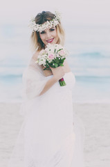 Fototapeta na wymiar Beautiful blond fiancee in white wedding dress