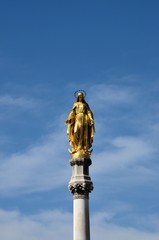 Zagreb, Croatia - March 29, 2015: A gilded statue of the Virgin Mary outside Zagreb's historically significant Catholic  Cathedral of the Assumption.