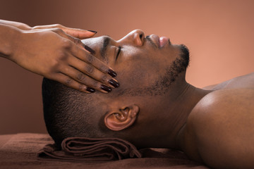Man Receiving Forehead Massage