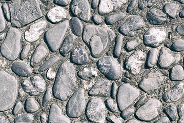 the round stone at the cement floor with the vintage scene