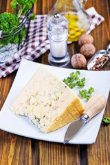 cheese on plate and on a table