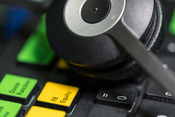 Close-up of headphones on colorful keyboard
