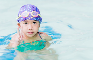 cute girl in swimming pool