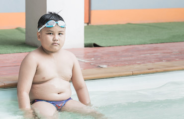 fat boy on swimsuit