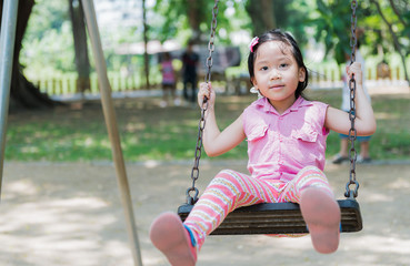 cute girl play swing seat