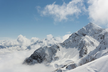 Fototapeta na wymiar Winter mountain landscape and cloudy sky.