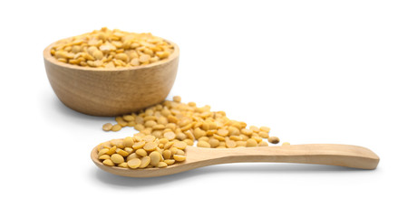 Soy beans on wooden spoon on white background 