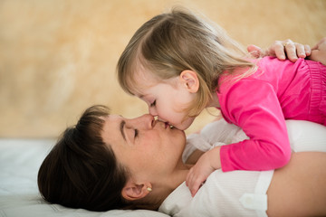 Obraz na płótnie Canvas Mother and child - kiss