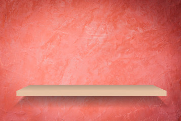 Empty shelf on handmade creative red wall