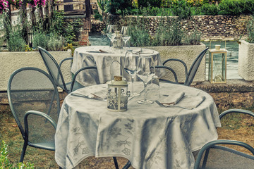 restaurant table in medieval village near river