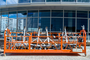 construction cradle against the background of building under construction