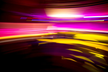 Colorful night club party lights in motion blur, abstract background design