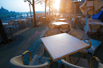 Street cafe in Dresden at sunrise