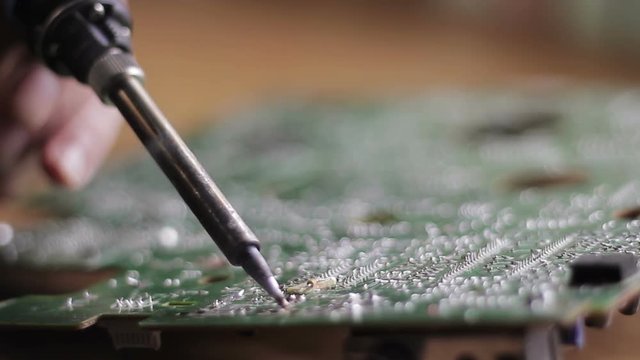 Technical Electronics Soldering motherboard engineer at work