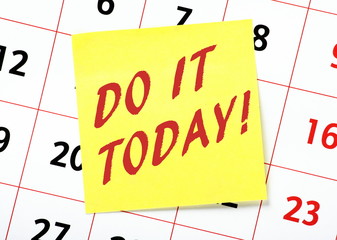 The phrase Do It Today in red text on a yellow sticky note posted on a calendar page as a reminder