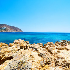 Fototapeta na wymiar in europe greece the mykonos island rock sea and beach blue sk