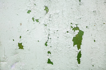 Old grunge material. Peeling green paint texture. Grunge background with old peeling paint. Old peeling paint with cracks.