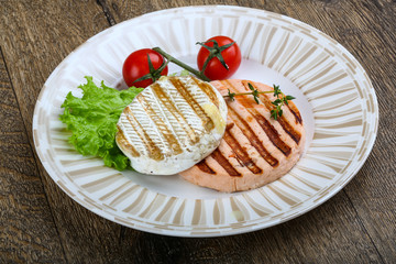 Grilled fish cutlet and camembert cheese