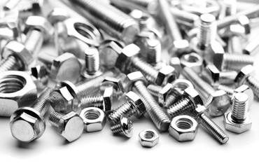 close up photo of steel bolts forming a texture
