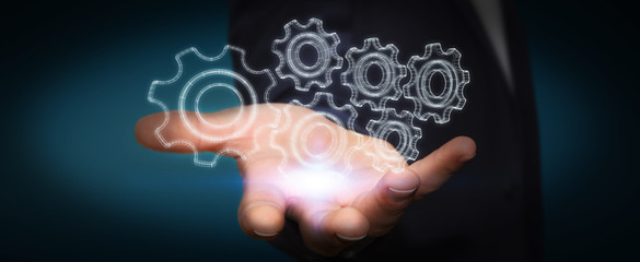 Businessman holding digital 3D engine