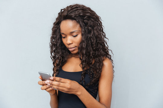Afro american woman using smartphone