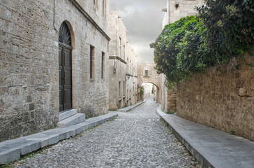 Fototapeta na wymiar Rhodes old town is oldest inhabited medieval town in Europe. Street of the Knights is one of the best preserved and most delightful medieval relics in the world. Rhodes Island, Greece.