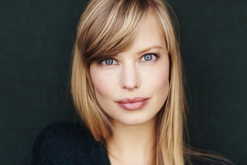 Naklejka premium Blue eyes on blond woman looking at camera