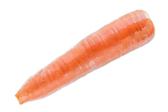 A carrot in plastic wrap isolated on white background.