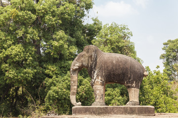 Fototapeta na wymiar Elephant statue in East Mebon temple, Siem Reap, Cambodia. reen trees background