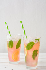 Fresh watermelon mojito on white wooden table
