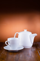 white tableware on wooden background