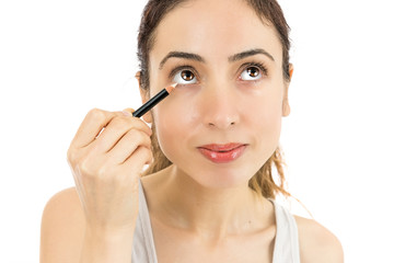 Woman applying eyeliner