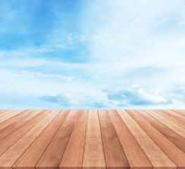 Wood table top on blue sky with clouds - used for display your products