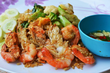 fried rice with shrimp and egg on white plate