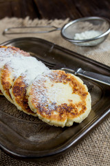 Сottage cheese pancakes  on metal plate