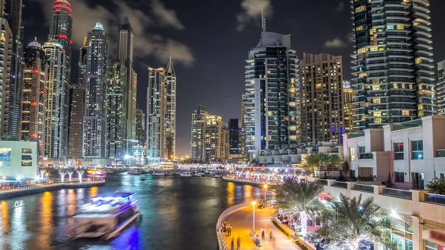 View of Dubai Marina Towers and canal in Dubai night timelapse hyperlapse