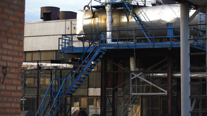 The facade of the old shop. The pipes and installations in bad condition,