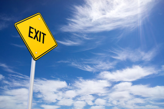 Yellow Road Sign with Exit Sign Inside on Blue Sky Background