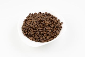 white plate full of coffee beans