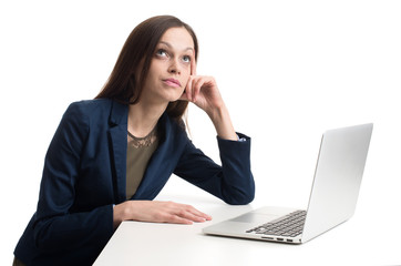 business woman with laptop daydreaming