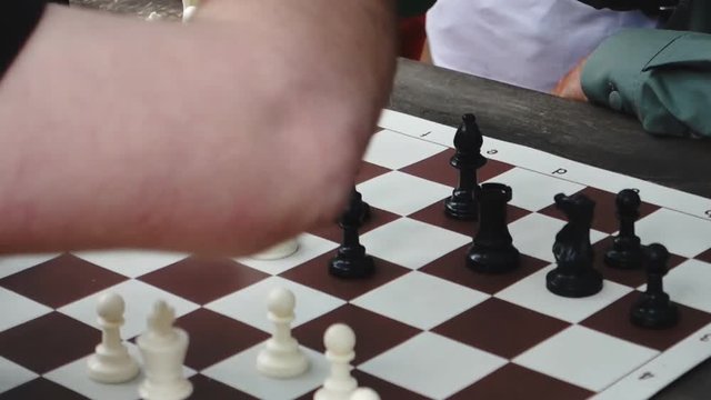 Close-up of chess game tournament with clock.