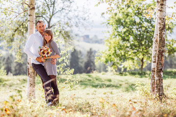 Portrait of love couple embracing outdoor in park.