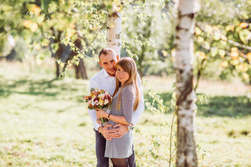 Fototapeta premium Portrait of love couple embracing outdoor in park.